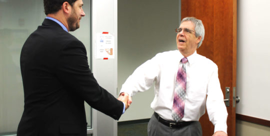 Handshake in board room