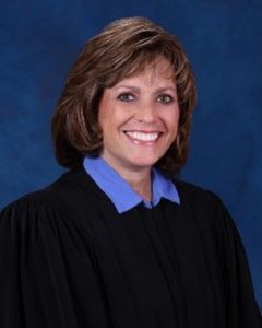 Smiling woman wearing a judicial robe