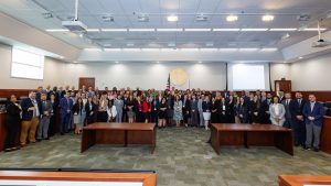 a large group of people posing for the camera